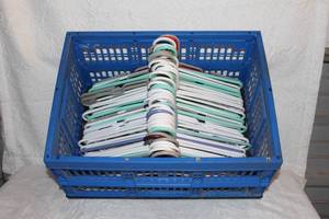 lot 405 image: Collapsible tote full of plastic hangers