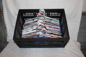 lot 406 image: Collapsible tote full of plastic hangers