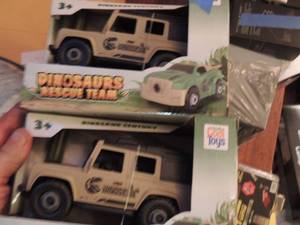 lot 58 image: DINO THEMED FRICTION JEEPS  QTY 2