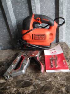 lot 43 image: black and decker saw, stapler and saw blades