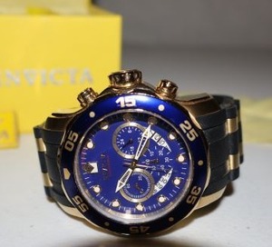 lot 8 image: INVICTA mens watch, blue face with yellow storage box and original tag. (Like New, needs battery)