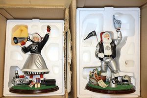 lot 25 image: Santa and Mrs. Claus Oakland Raiders 10 figurines - 2 times the money.