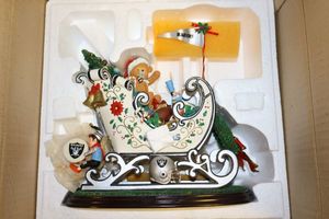 lot 28 image: Oakland Raiders Santas Sleigh 9.5 figurine (drummers arms need re-glued)