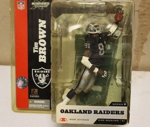 lot 31 image: Oakland Raiders Tim Brown figurine still in packaging