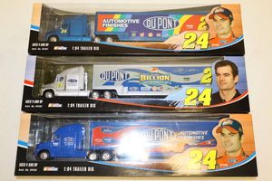 lot 46 image: Jeff Gordon 164 scale Trailer rigs - 3 total still in packaging