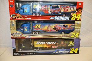 lot 66 image: Jeff Gordon 164 scale Trailer rigs - 3 total still in packaging