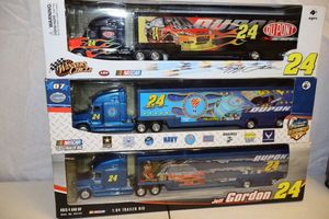 lot 65 image: Jeff Gordon 164 scale Trailer rigs - 3 total still in packaging