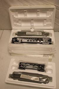 lot 76 image: Oakland Raiders model train cars and track Going Long and Victory rail cars