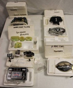lot 96 image: Oakland Raiders Christmas ornaments