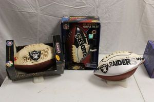 lot 99 image: Oakland Raiders footballs - 3 total