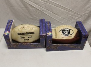 lot 100 image: Oakland Raiders footballs - 2 total