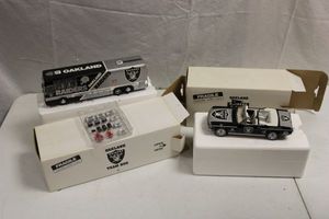 lot 101 image: Oakland Raiders model team car and bus
