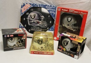 lot 102 image: Oakland Raiders mini helmets and clock