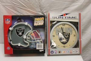 lot 103 image: Oakland Raiders clock and neon helmet sign