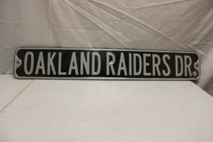 lot 105 image: Oakland Raiders Dr. metal sign