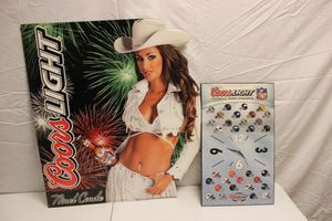 lot 109 image: Coors Light wall clock and Ninel Conde sign