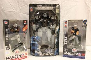 lot 111 image: Oakland Raiders Cleatus robot and figurines Cooper and Carr