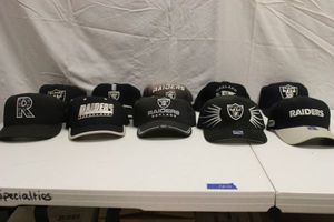 lot 120 image: Oakland Raiders ball caps