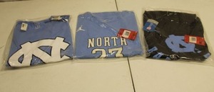 lot 131 image: North Carolina Nike shirts - still n packaging