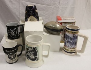 lot 137 image: Oakland Raiders mugs, candle, and sand football as shown