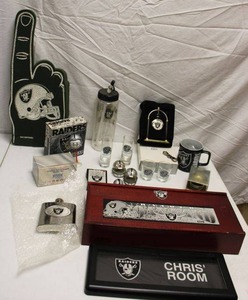 lot 138 image: Oakland Raiders items flask, S&P shakers, pewter helmet, desk clock and more