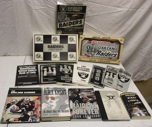 lot 139 image: Oakland Raiders books, checkers game, license plate clock, and 3x5 flag