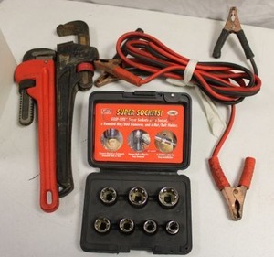 lot 149 image: Tools battery cables, 14 pipe wrenches, and socket set