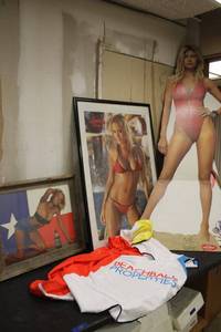 lot 183 image: Lifesize Baywatch sign, Hawaiian Topic poster, and Jack Daniels print