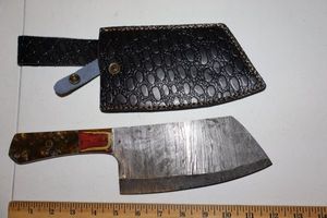 lot 241 image: 7  blade Cleaver with leather sheath. With handle it measures 12