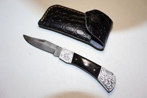 lot 71 image: Folding pocket knife with sheath