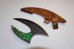 lot 104 image: Ulu knife with sheath