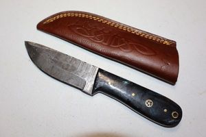 lot 140 image: Hunting knife with sheath