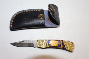 lot 284 image: Folding pocket knife with sheath