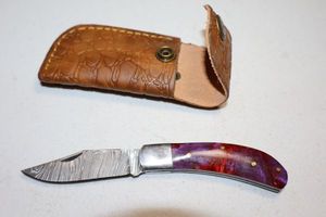 lot 292 image: Folding pocket knife with sheath