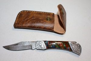 lot 392 image: Folding pocket knife with sheath