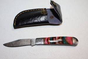 lot 393 image: Folding pocket knife with sheath