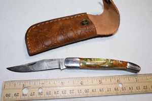 lot 394 image: Folding pocket knife with sheath