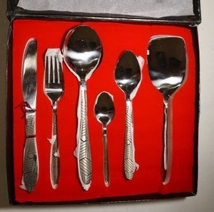 lot 212 image: MHS Cutlery set. Features 2 spatulas, 6 forks, 6 knives, 6 teaspoons, 6 tablespoons, and 2 large serving spoons