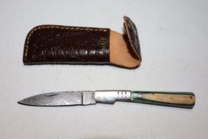 lot 328 image: Folding pocket knife with sheath