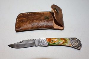 lot 331 image: Folding pocket knife with sheath