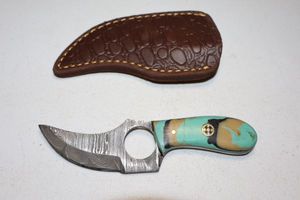 lot 346 image: Skinning knife with finger hole and sheath