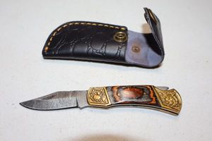 lot 369 image: Folding pocket knife with sheath
