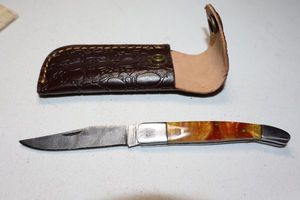lot 370 image: Folding pocket knife with sheath