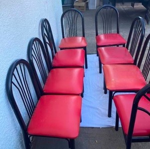 lot 19 image: SET OF 8 BLACK METAL CHAIRS WITH RED VYNIL-COVERED AND PADDED SEATS.FROM AAA FURNITURE WHOLESALE.