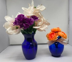 lot 22 image: 2 BLUE VASES WITH ARTIFICIAL FLOWER ARRANGEMENTS, ONE IS 8T &amp THE OTHER IS 6.5T