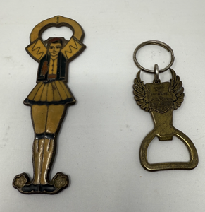lot 44 image: 2 BRASS KEYCHAIN BOTTLE OPENERS&nbsp 1) 2-SIDED HARLEY DAVIDSONMILLER HIGH LIFE SPONSORED OPENER WITH SPREAD EAGLE WINGS&nbsp AND 2) GREEK DANCER, ONE SIDE WITH COLORED ENAMEL GREEK DANCER, THE OTHER WITH ETCHED FEATURES ON THE METAL OUTLINE