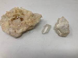 lot 55 image: CRYSTALS (3)&nbsp - 3 Piece lot. Crystal various sizes, shapes, and colors. 1 Tan and white 6T x 5W x 2.75D. 2 White 275T x 2W x 2D. 3 Clear 2.25T x .75W x .75D.