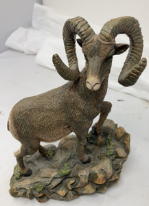 lot 86 image: SHEEP STATUEHORNED RAM - Ram standing on rocks. 8.3 x 6W x 3D.&nbsp