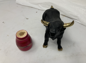 lot 88 image: BLACK AND GOLD CERAMIC BULL WRED WOOD BARREL. -&nbsp&nbsp5T x 8L.&nbsp Comes with a red wood barrel. 2.25T x 1.75Diam.&nbsp