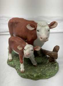 lot 90 image: COW WITH CALF FIGURINE. - 6T x 2.75W x 3.75D.